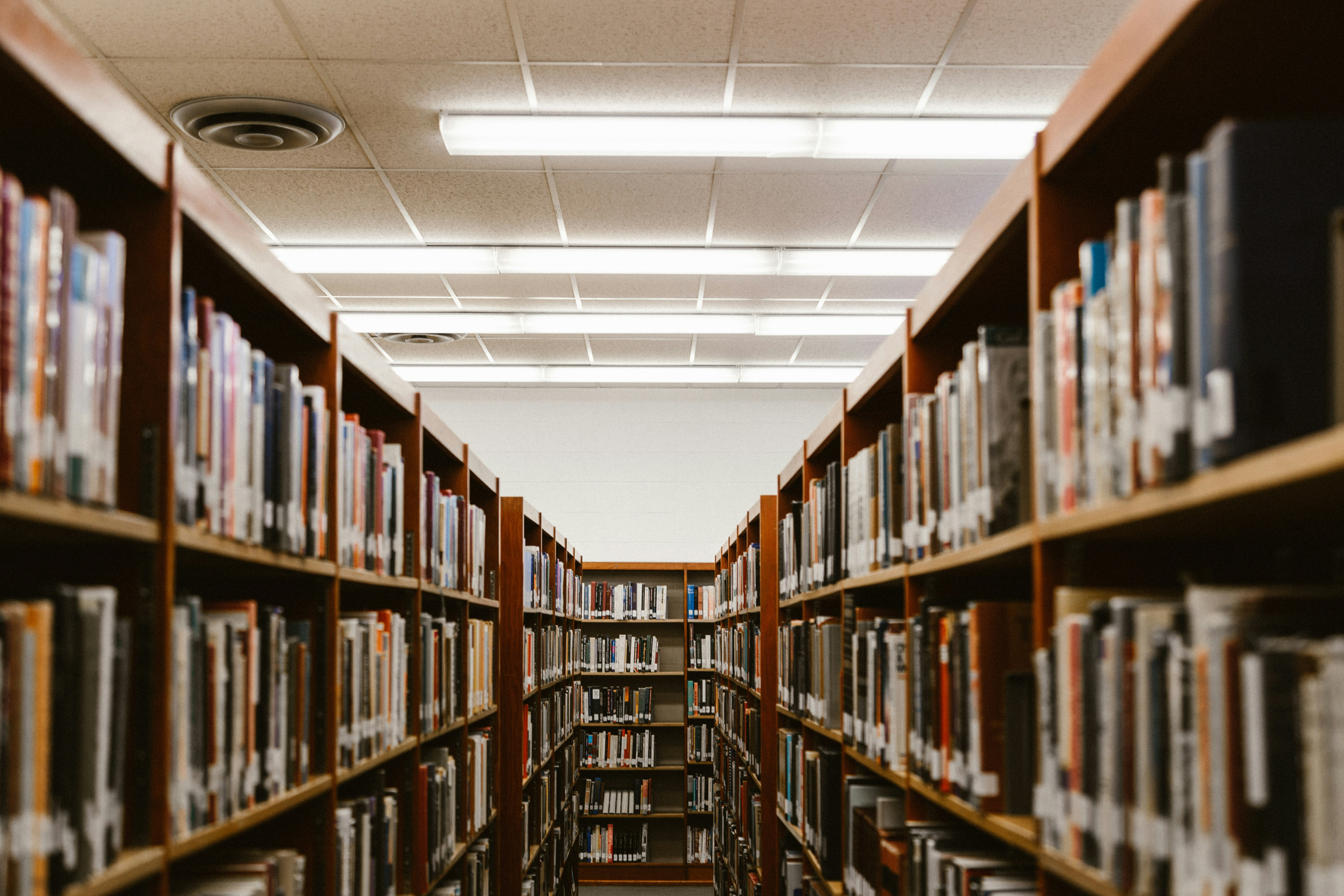 Photo of a row of books in a library.